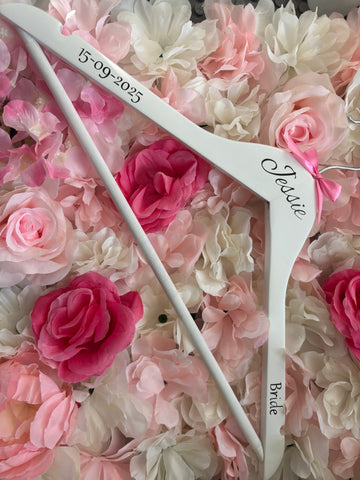 White wooden wedding hangers