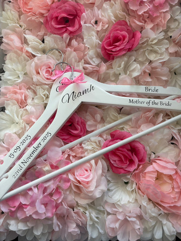 White wooden wedding hangers