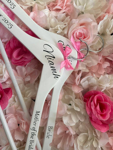 White wooden wedding hangers