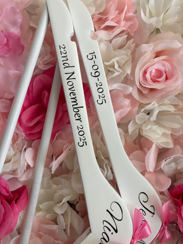White wooden wedding hangers
