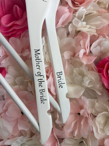 White wooden wedding hangers