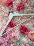 White wooden wedding hangers