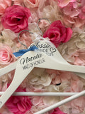 White wooden wedding hangers