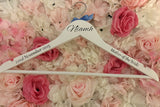 White wooden wedding hangers